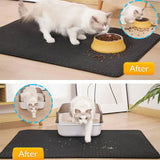 Cat using a black mat to eat from a bowl and later use a litter box on the same mat.