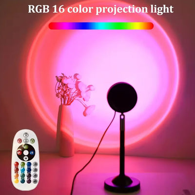 Sunset projection lamp casting a pink sunset glow on a bedroom wall with 16-color RGB remote control