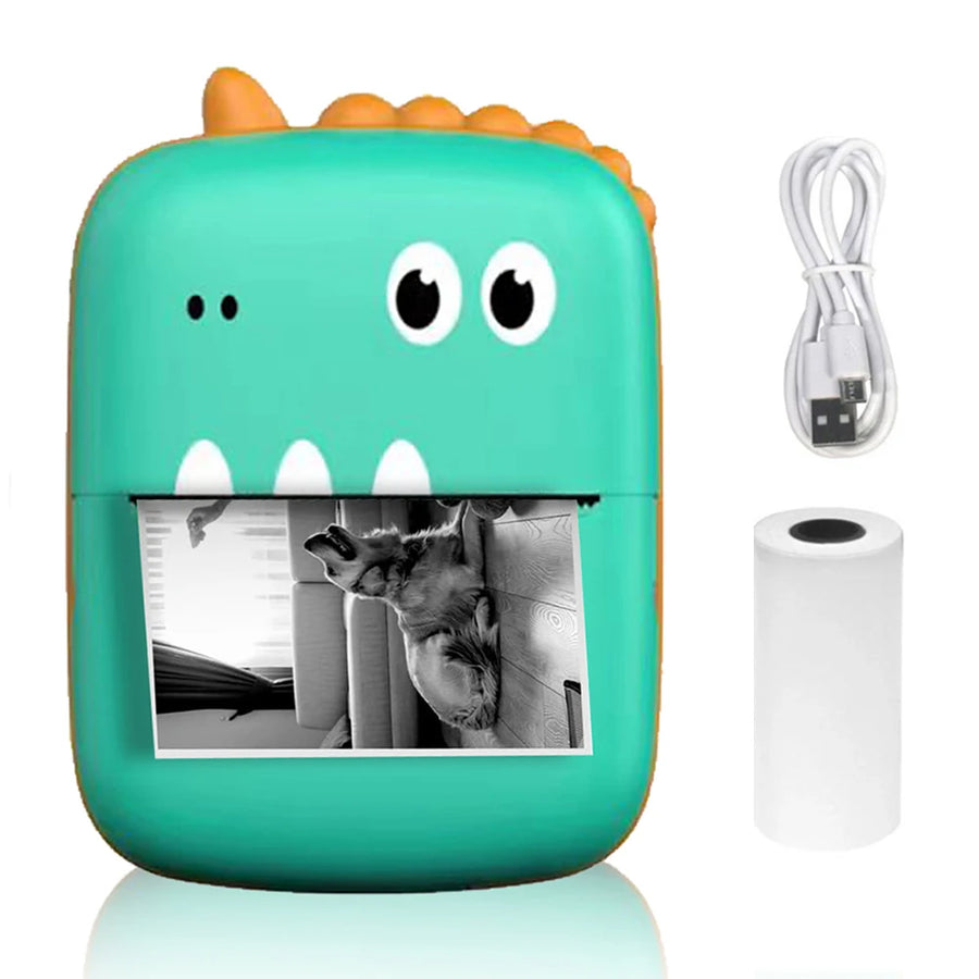 Dinosaur-shaped mini Bluetooth thermal label printer with paper roll and cable on white background