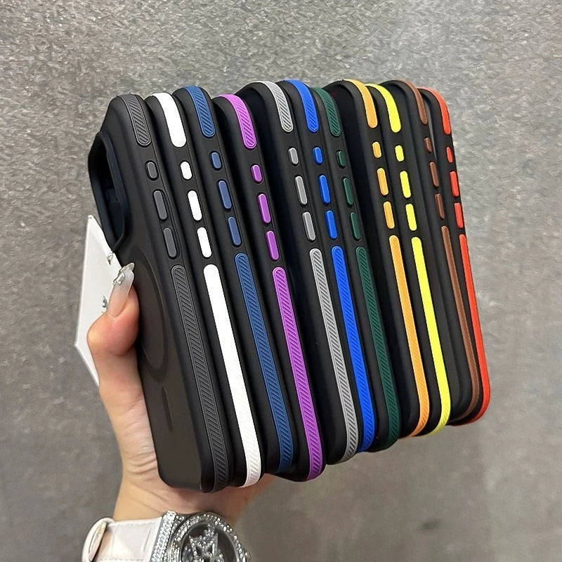 Hand holding a stack of colorful phone cases against a gray background