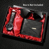 Black watch, black sunglasses, and black wallet on red velvet inside a box with 'Box Is Not Included' text.
