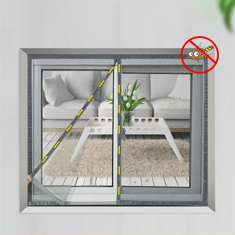 Customizable magnetic window screen mesh curtain installed on a living room window, blocking mosquitoes and insects while letting fresh air in