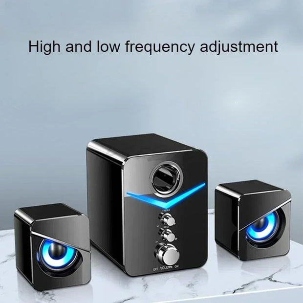 Wired desktop speakers with high and low frequency adjustment, featuring a sleek design and vibrant LED lighting.