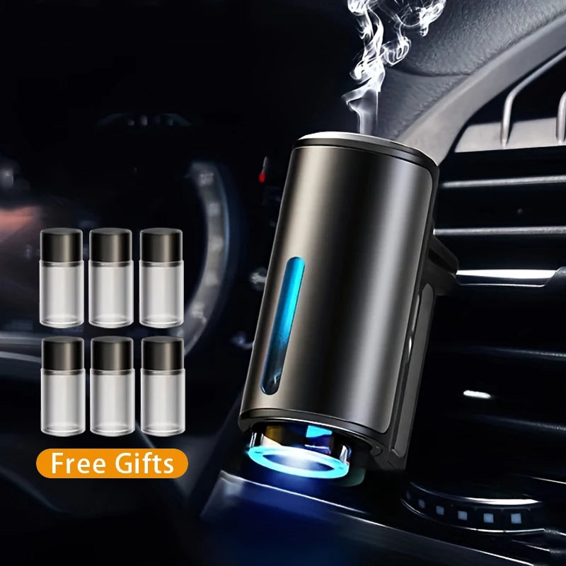 Electric car aroma diffuser humidifier – car air freshener with free gift bottles displayed in car interior