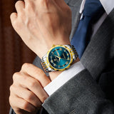 Men's minimalist quartz leisure watch – close-up of person wearing luxurious watch with blue face and gold accents
