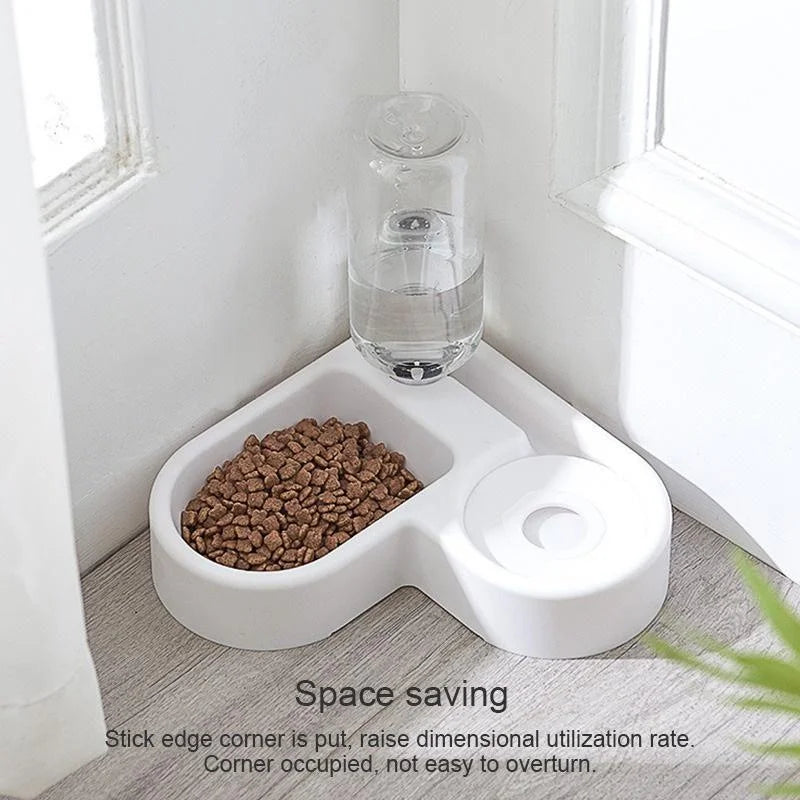 White pet feeder with a bowl of food and a water bottle on a wooden floor.