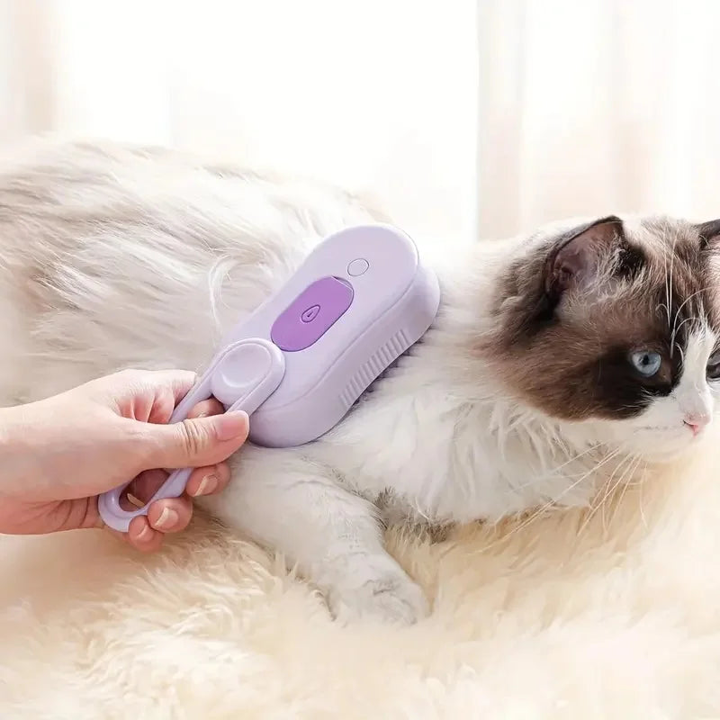 Person using the purple pet steam brush on a cat lying on a fluffy surface – 3-in-1 deshedding grooming comb with steam spray