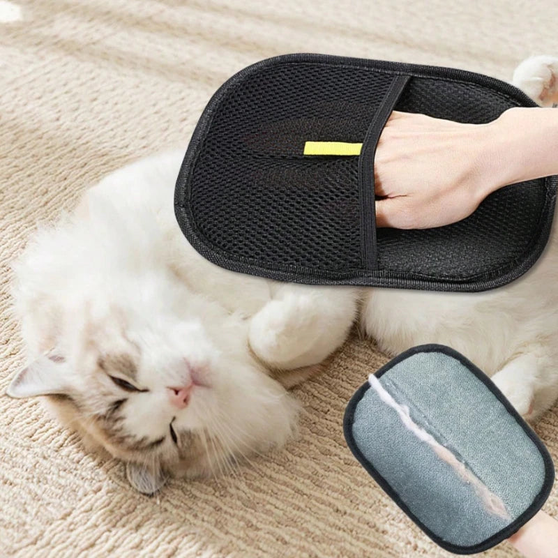 Pet hair remover mitt on a white cat – black mesh grooming mitt collecting cat fur