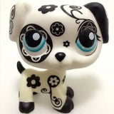 Mini pet shop puppy figure – white with black floral and swirl patterns and blue eyes