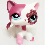 Mini pet shop kitty figure – white with pink patches, blue eyes and glitter eye patch