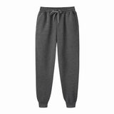 Men's gray jogger sweatpants with adjustable drawstring waistband on white background