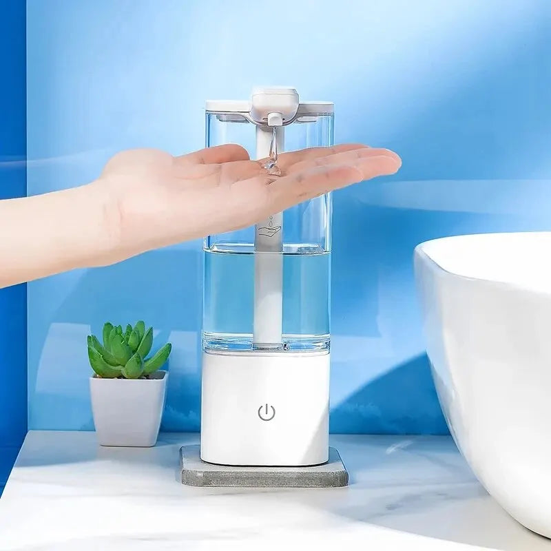 Touchless automatic hand sanitizer dispenser dispensing soap into an open hand beside a bathroom sink