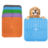 Dog with a blue mat and other colored mats on a white background