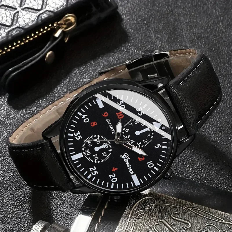 Black wristwatch with detailed face on a textured surface