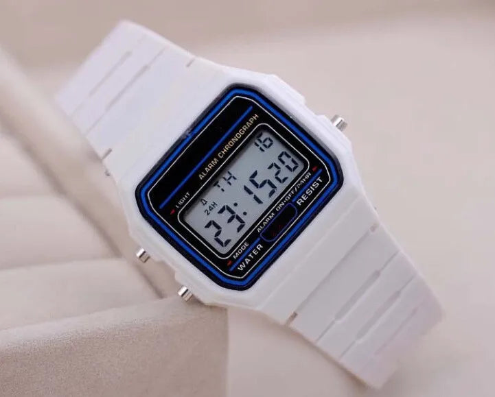 Men's white LED digital military watch with blue accents showing time on display, vintage digital wristwatch on beige background.