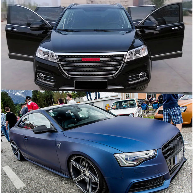 Black luxury SUV with open doors and a matte blue sports car parked outdoors.