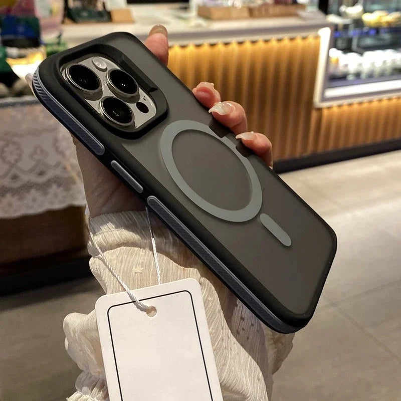 Phone case with a tag held by a person in an indoor setting