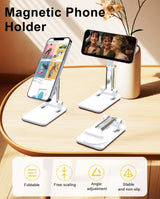 Magnetic phone holder with multiple devices on a wooden surface, featuring foldable, free-scaling, angle adjustment, and stable design.