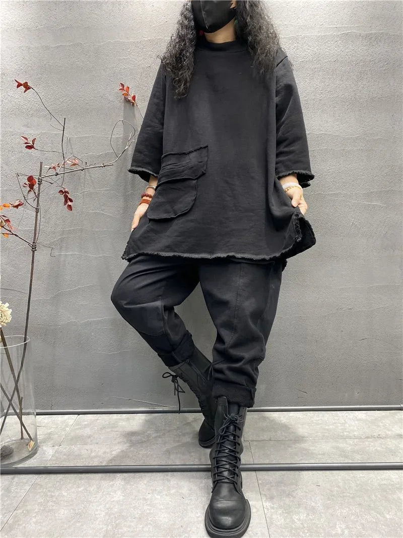 Womens plus size long sleeve top in black, loose fit casual t-shirt on plain background