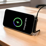 240W Type-C fast charging cable – phone with wireless charging pad on wooden surface