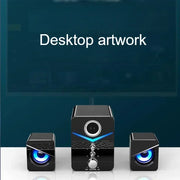 Wired desktop speakers showcasing a sleek design with blue LED lights and a volume control knob.