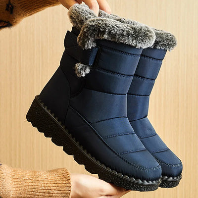 Women's Waterproof Winter Boots in navy with faux fur trim, perfect for cold weather and stylish winter wear.