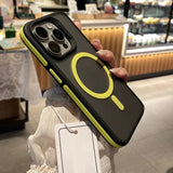 Phone case with yellow accents held by a person in an indoor setting