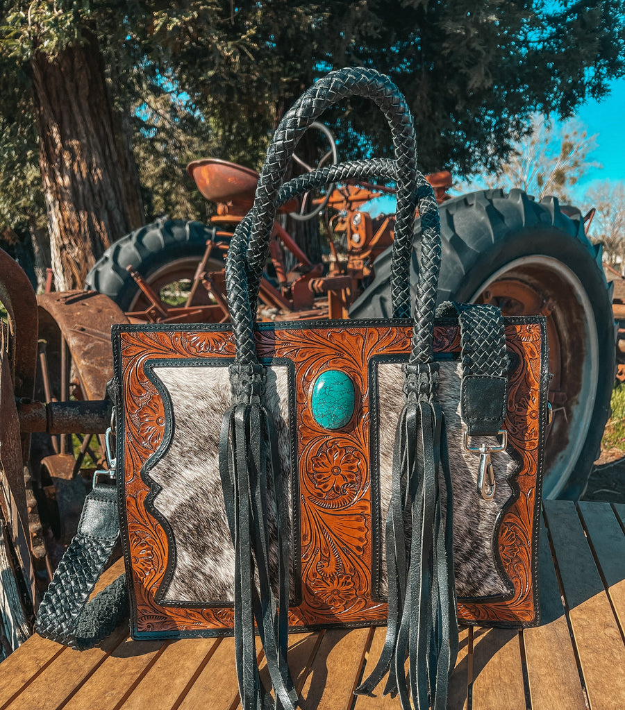 Tooled leather and cowhide western crossbody handbag with turquoise stone, braided handles and fringe